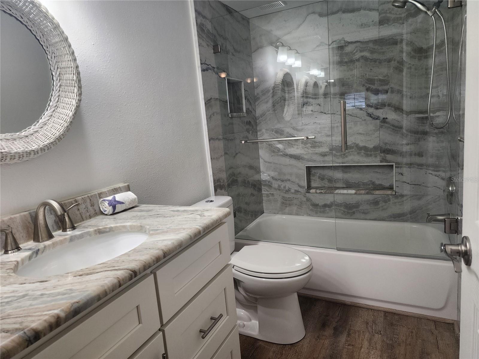 Gorgeous Granite and Tile work. Shower/Tub