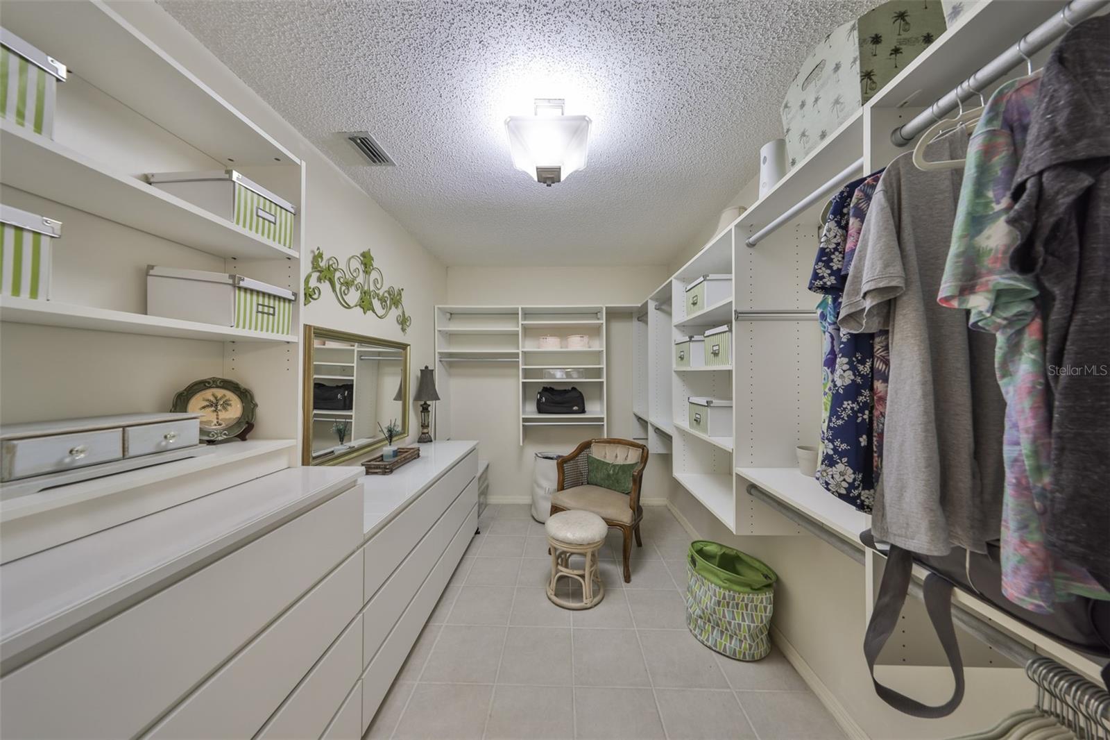 Huge Primary Closet with High-end Custom Cabinets