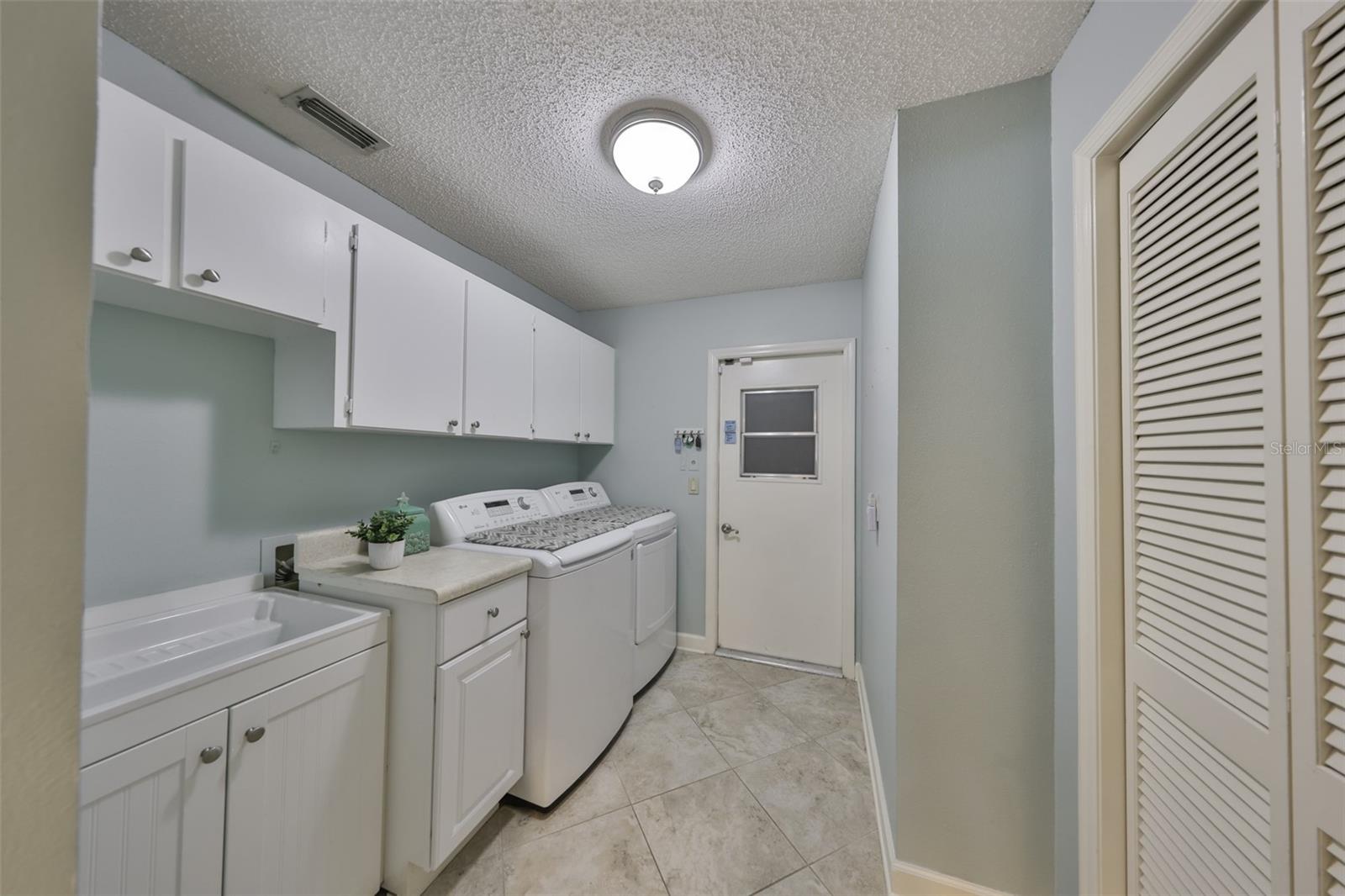 Spacious Laundry Room w/Custom Cabinets & 2 Spacious Closets