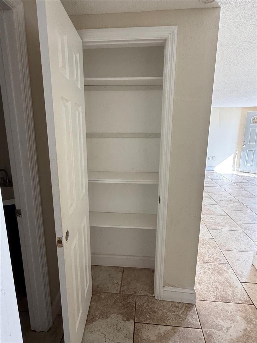larger linen closet by bathroom
