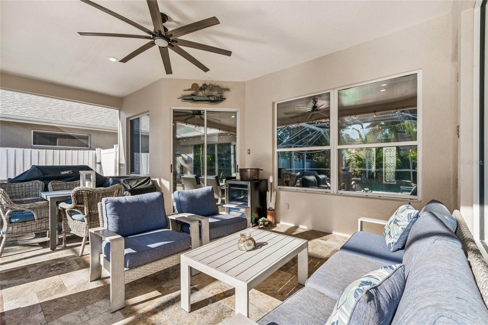 Covered lanai and pool is accessible from primary bedroom, kitchen, family room and pool bath