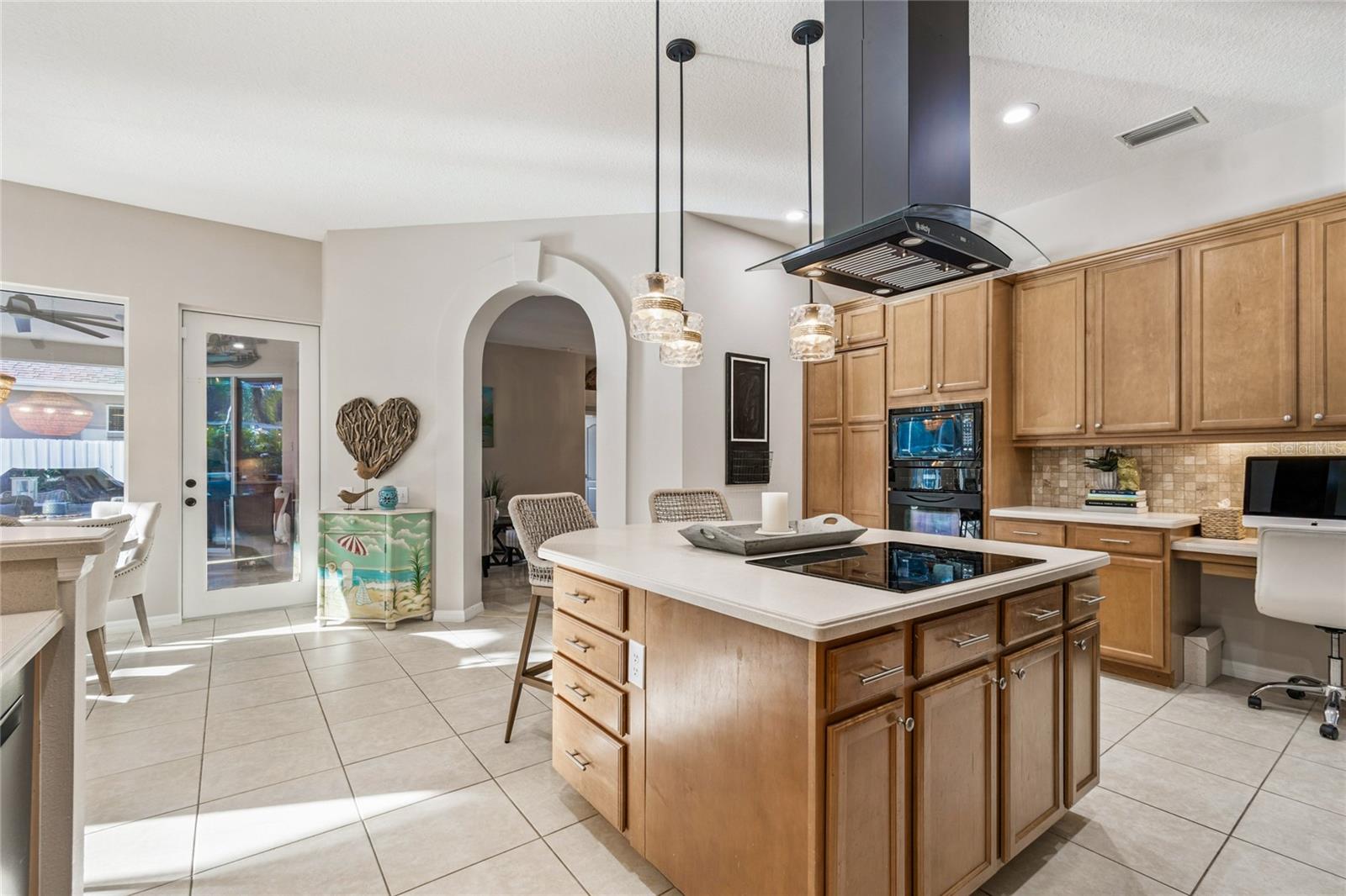 Kitchen view -- French door to lanai and pool area
