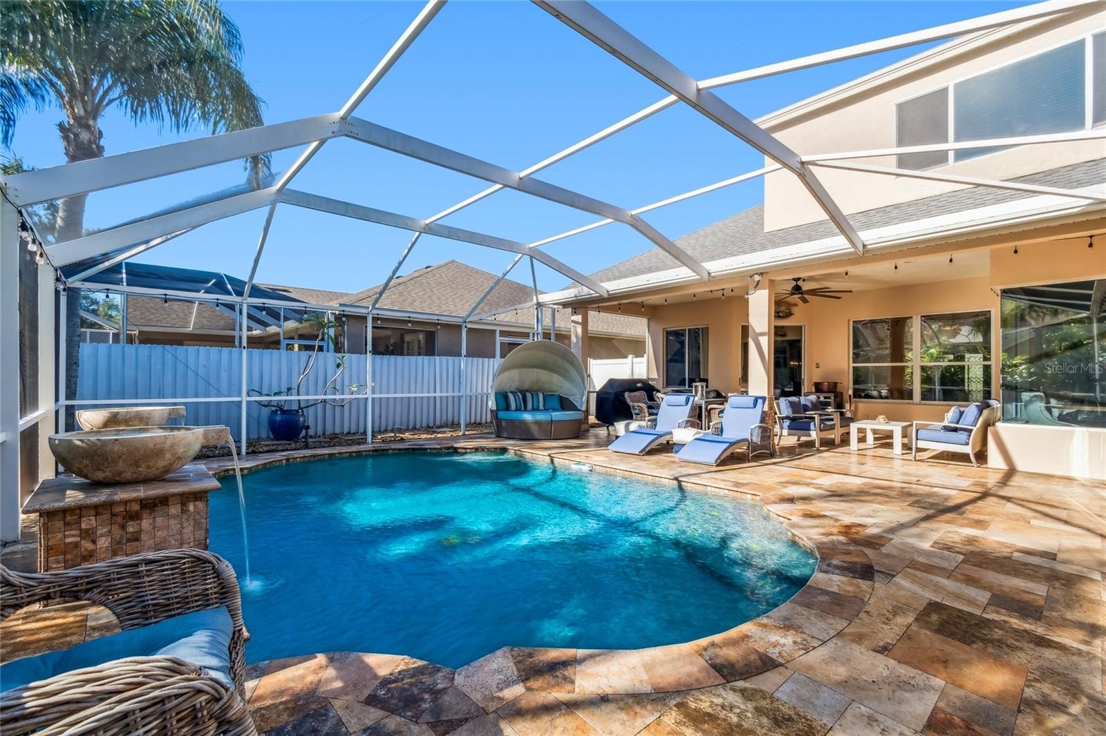 Pool view with travertine decking