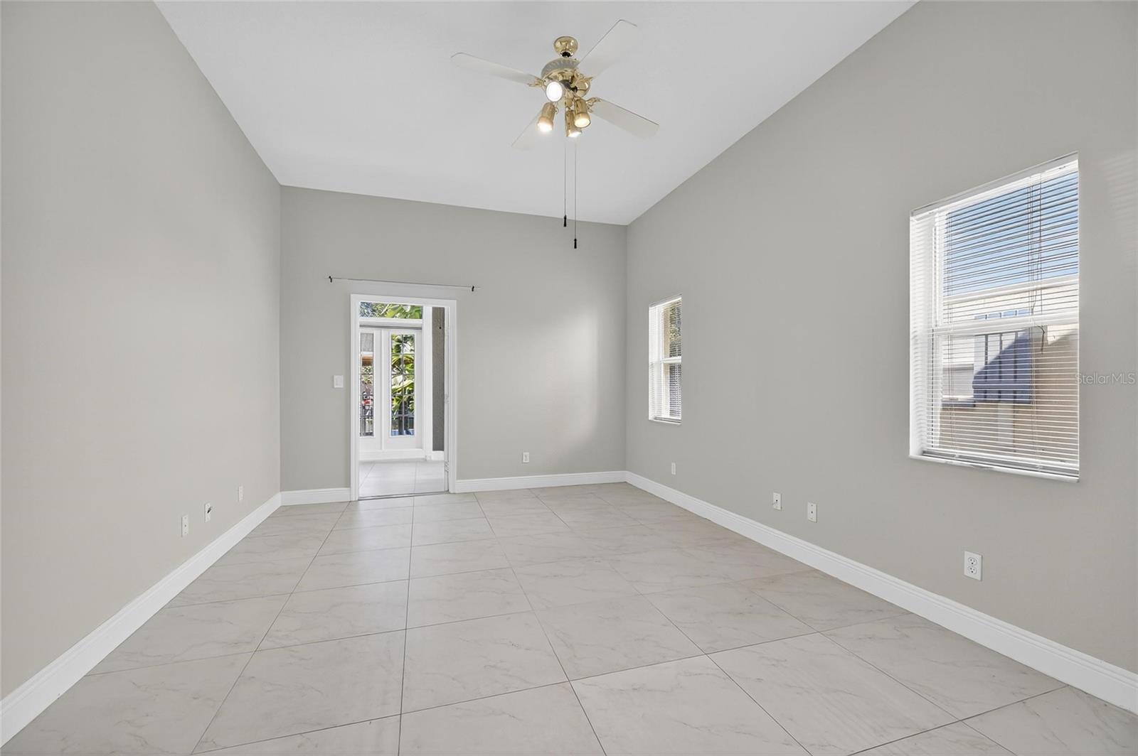Primary bedroom on the first floor with an exit to the Florida room.
