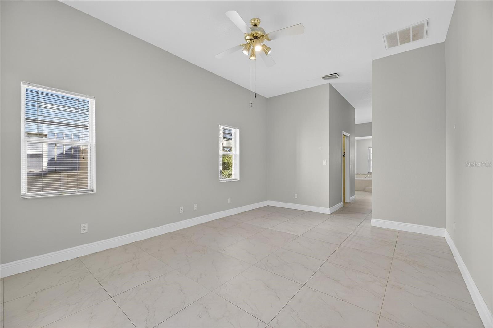 Primary bedroom looking into the ensuite bathroom.