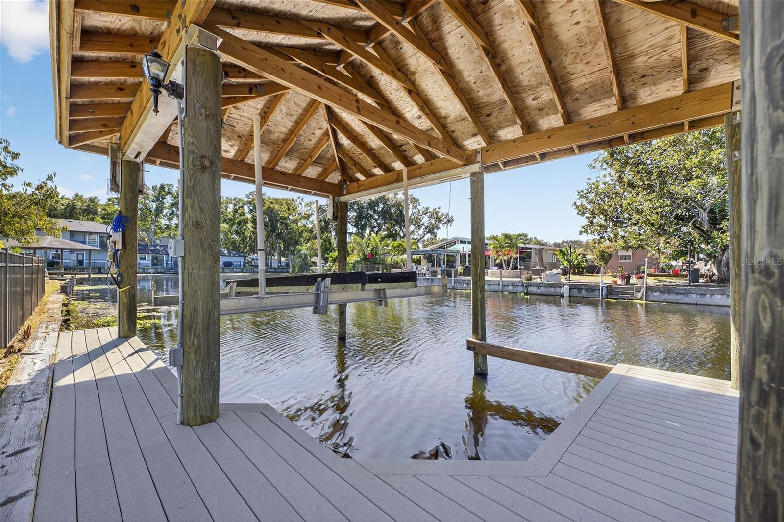 Covered boat lift with composite dock.