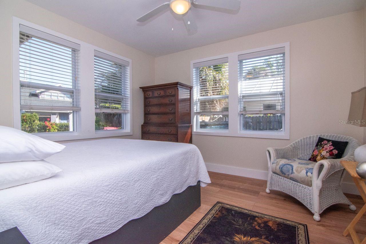 Primary bedroom. With the 4 windows. The lighting is delightful.