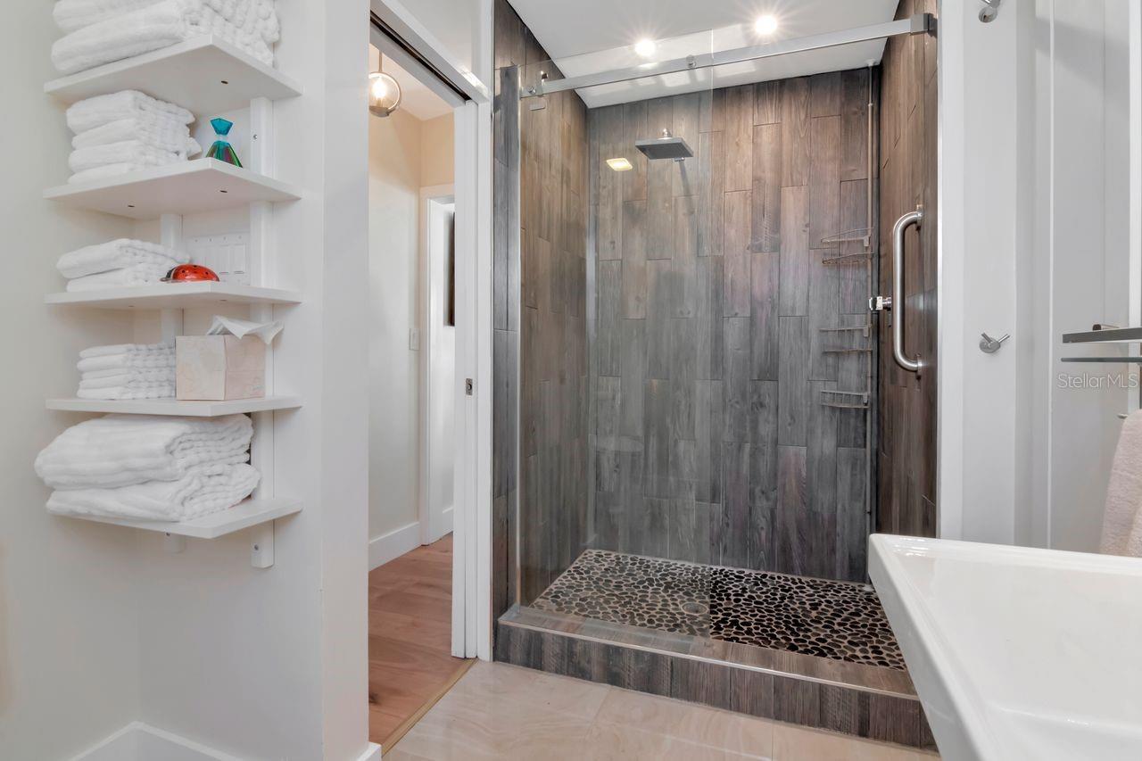 Bath with walk in shower ad plenty of space.