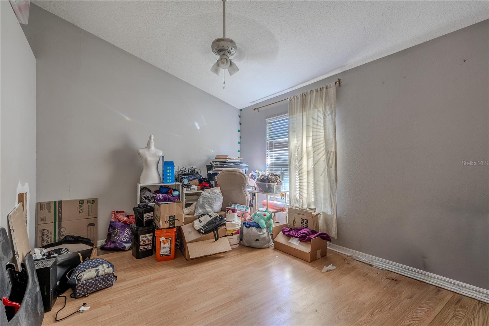 The second bedroom combines simplicity and sophistication, featuring a serene water view that brings the outdoors in. A streamlined walk-in closet enhances the space’s clean design and practical comfort.
