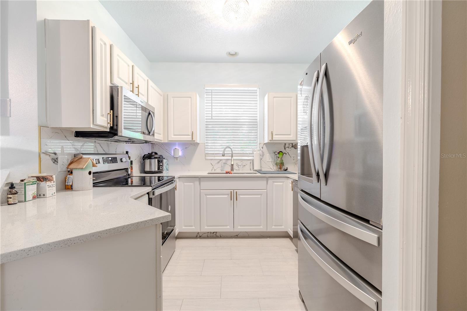 Smart, stylish, and open to the action—the kitchen makes the most of its smaller footprint. A breakfast bar bridges the space between cooking and conversation, keeping the flow easy and the energy connected from the living area to the dining table.