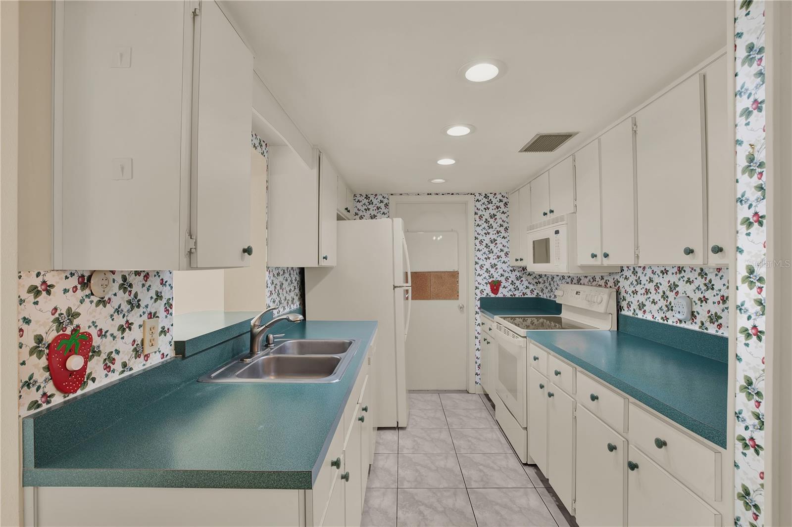 This galley kitchen serves as a wonderful blank canvas for your own updates and design style.