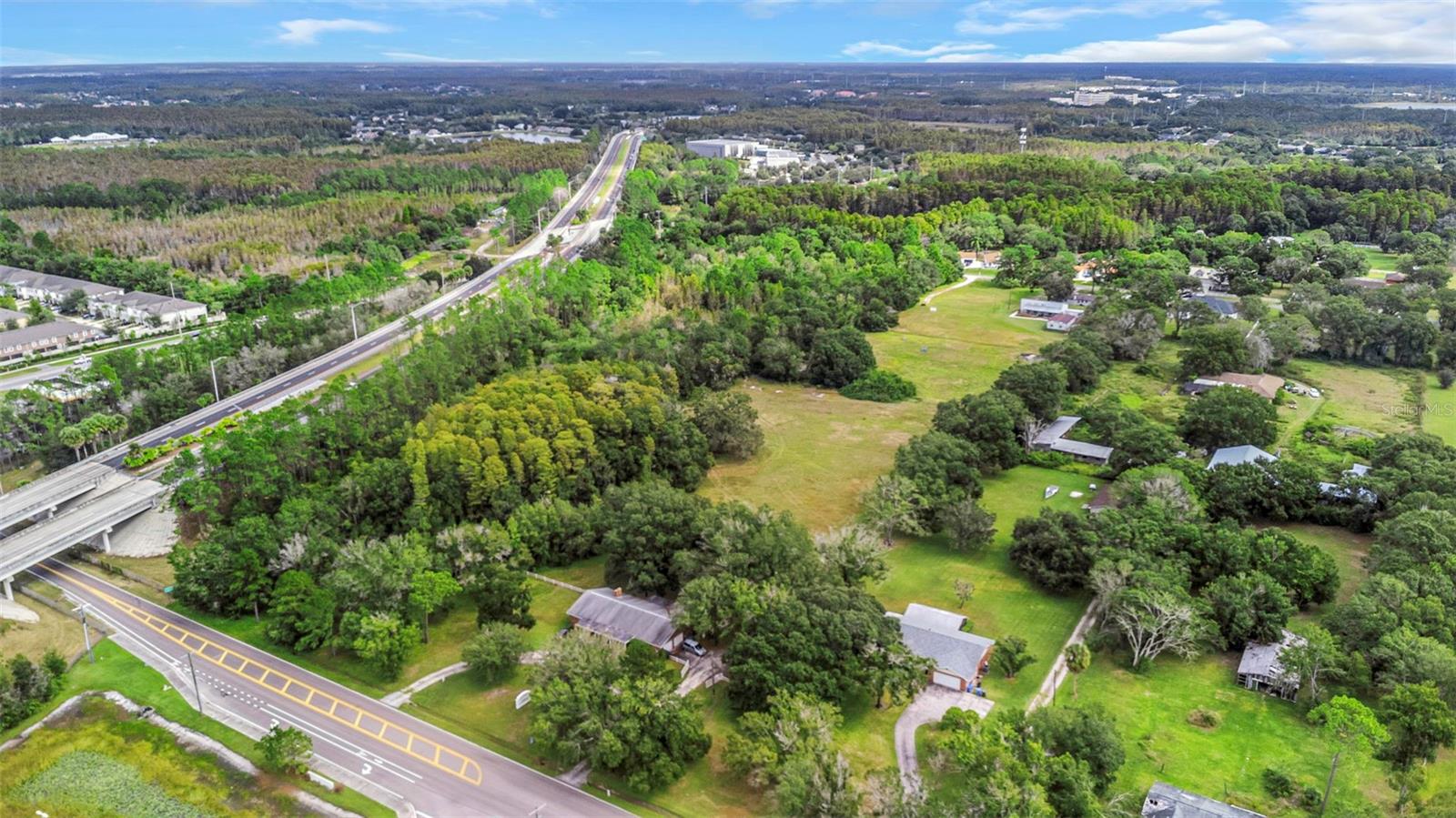 View of both properties with Lakeshore at the bottom of photo.