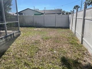 side yard with vinyl fencing