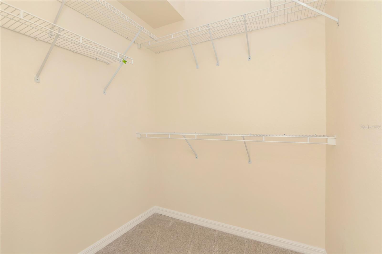 1 of 2 walk-in closets in Primary bedroom