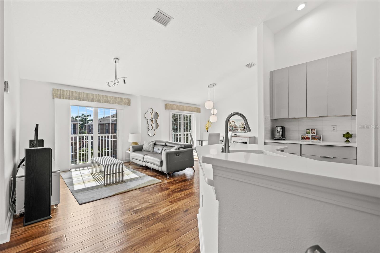 Entry Stairs Open to Kitchen and Living Room