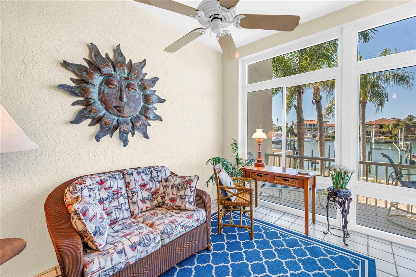 All seasons enclosed patio over looks pool and canal