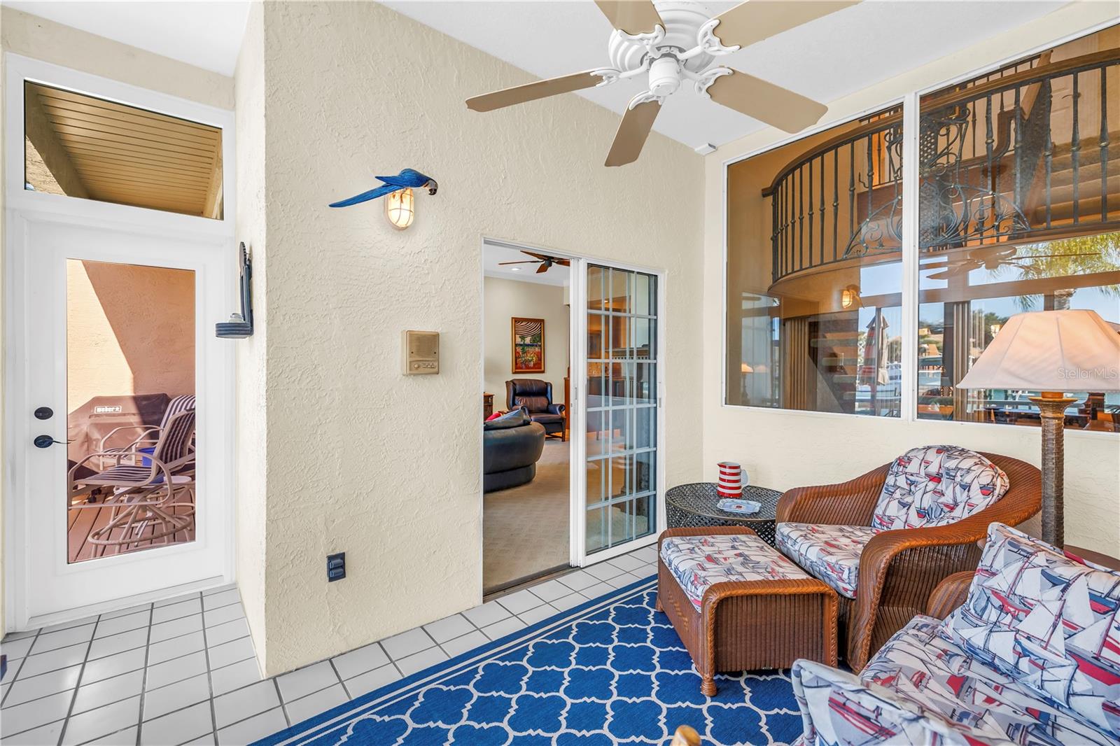 All seasons enclosed patio over looks pool and canal