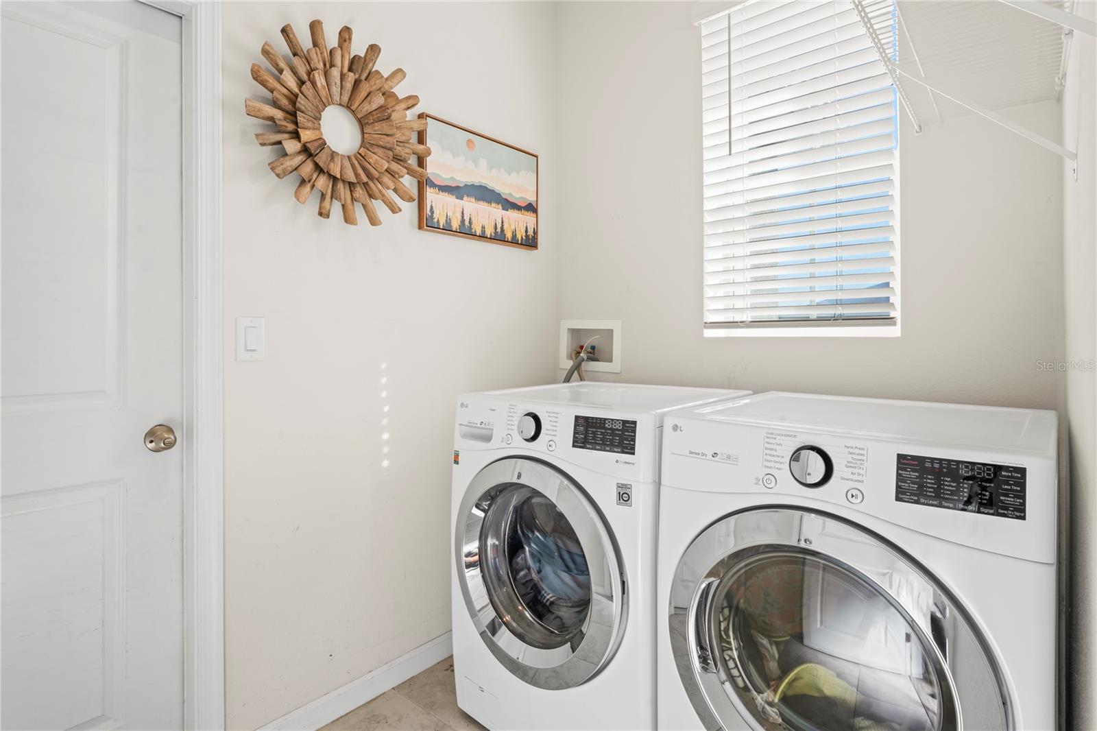 Bright laundry room that leads into the garage