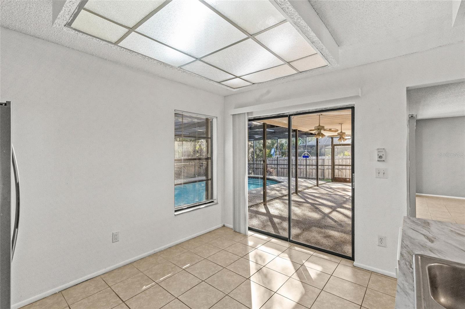 Kitchen with glass slider onto the pool area