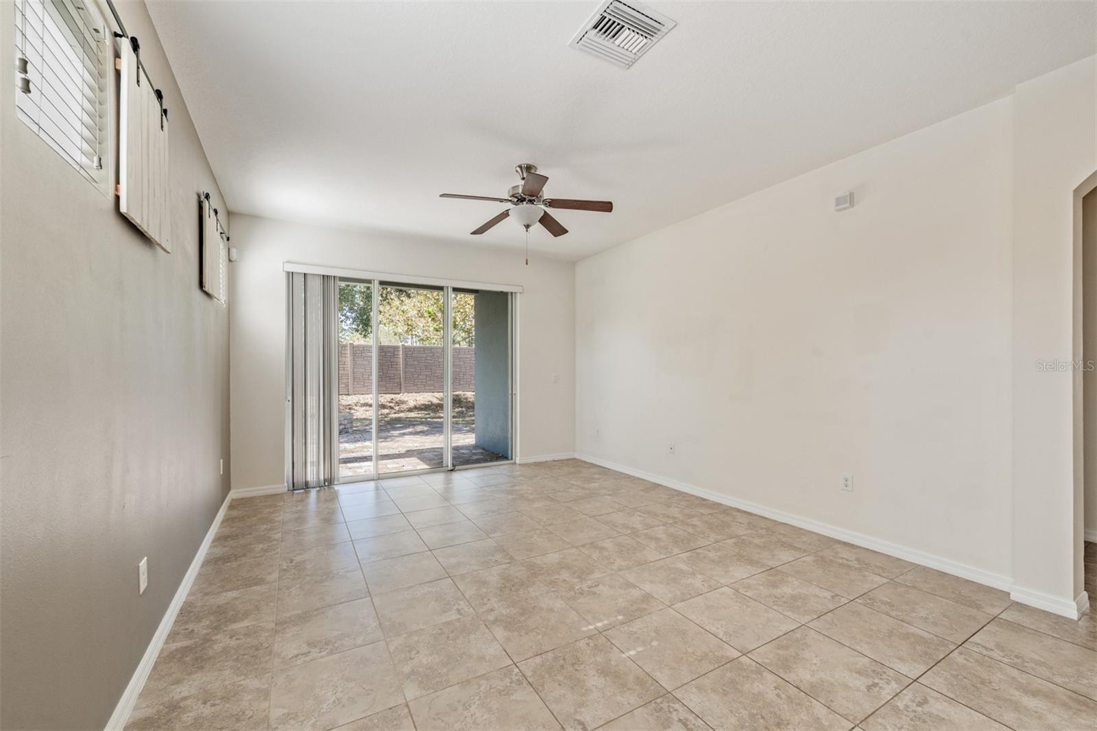 Family Room - open to the kitchen and back patio - Ceiling Fan with light fixture