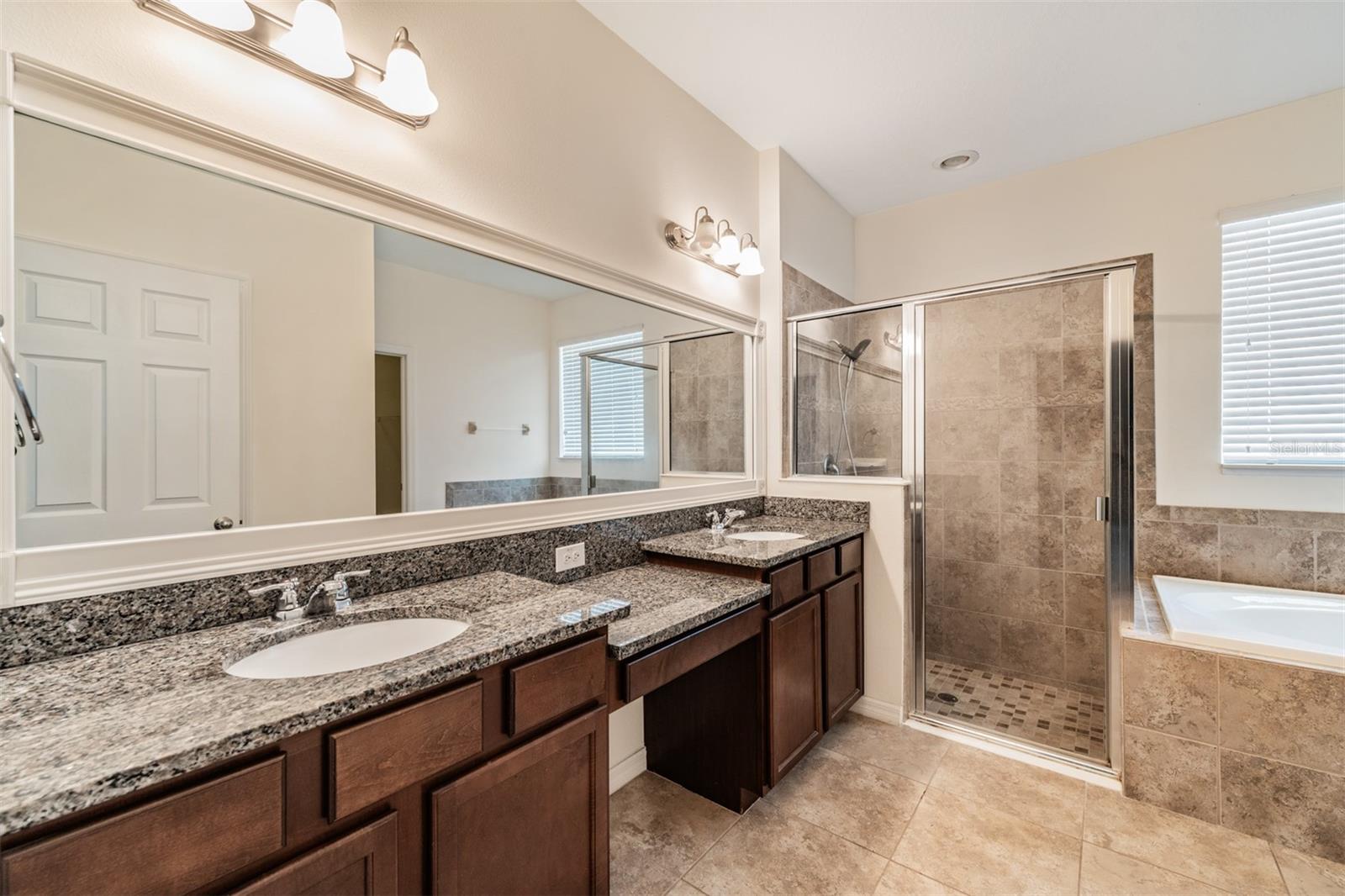 Double Vanities, Tile Flooring, Granite Counter tops, Large Shower and Separate Tub