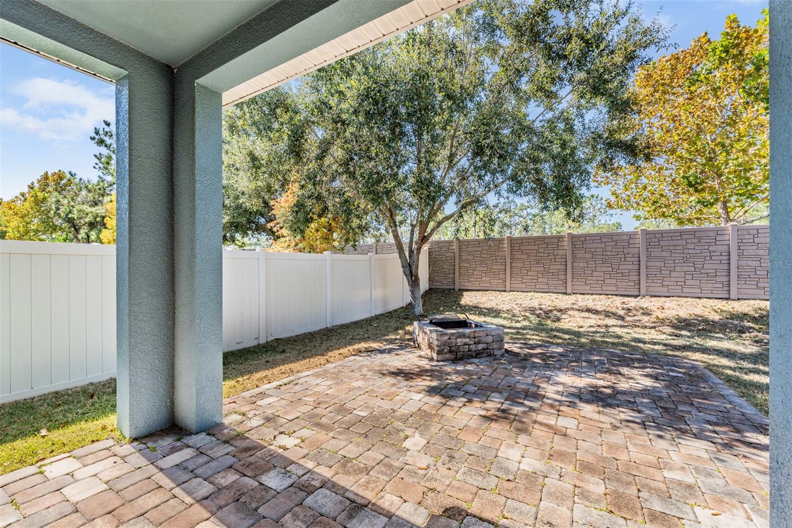 Covered and open back porch with pavers