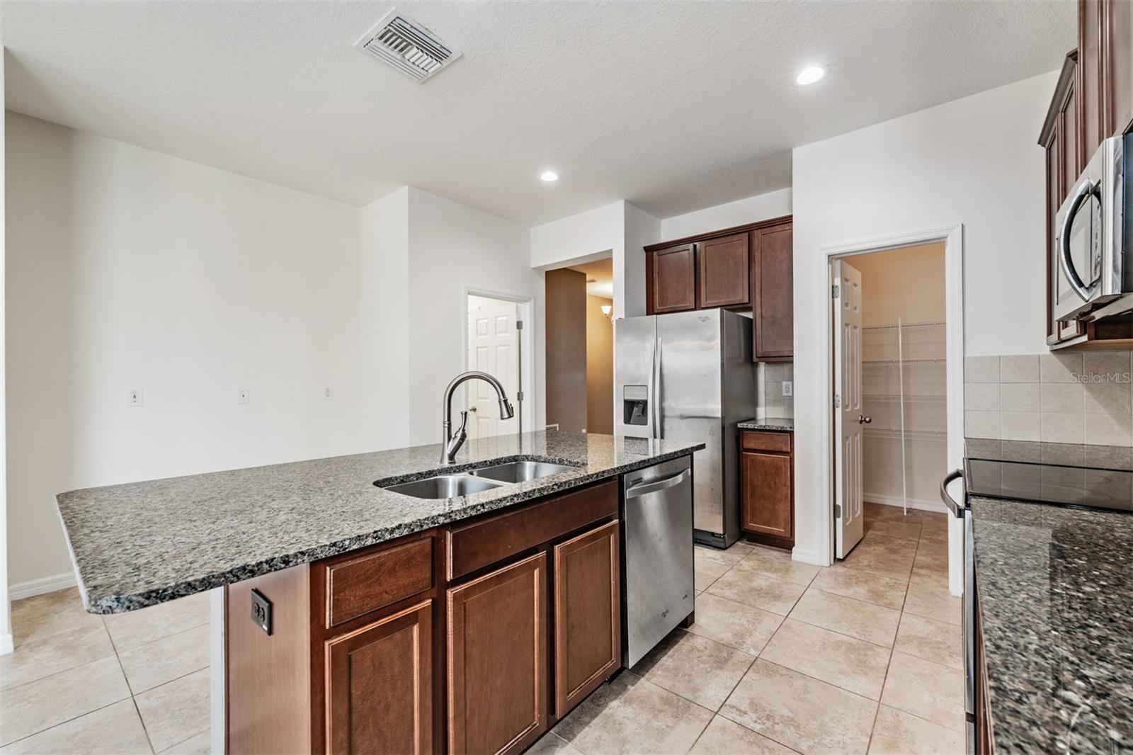 Kitchen - lots of counter top space and cabinets for storage, along with a pantry, Stainless Steel Appliances