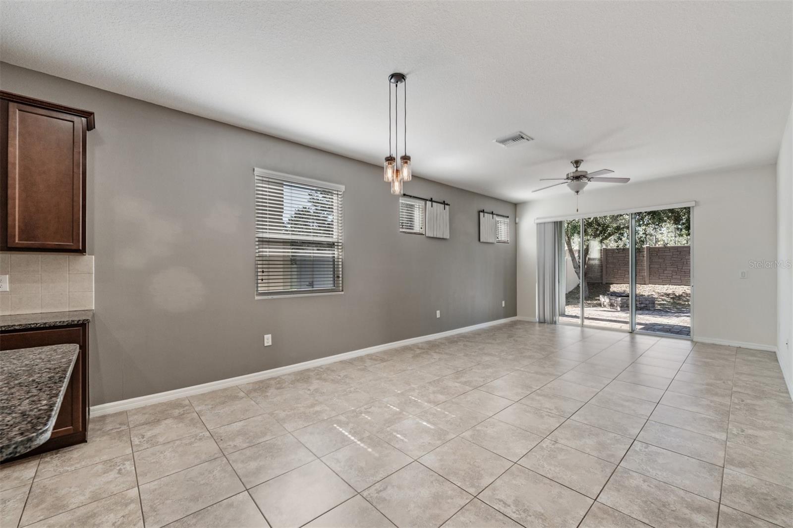 Family Room - open to the kitchen and back patio - Ceiling Fan with light fixture