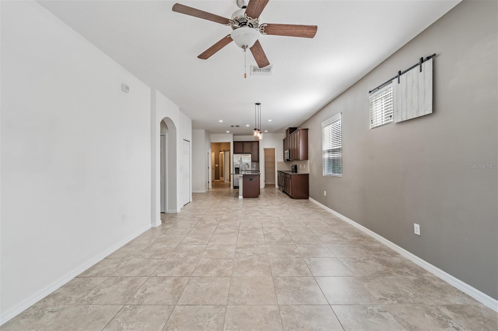 Family Room - open to the kitchen and back patio - Ceiling Fan with light fixture