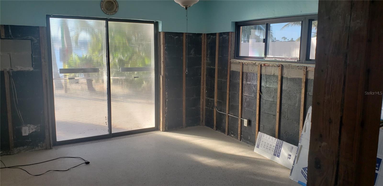 Primary Bedroom with slider to yard with waterview