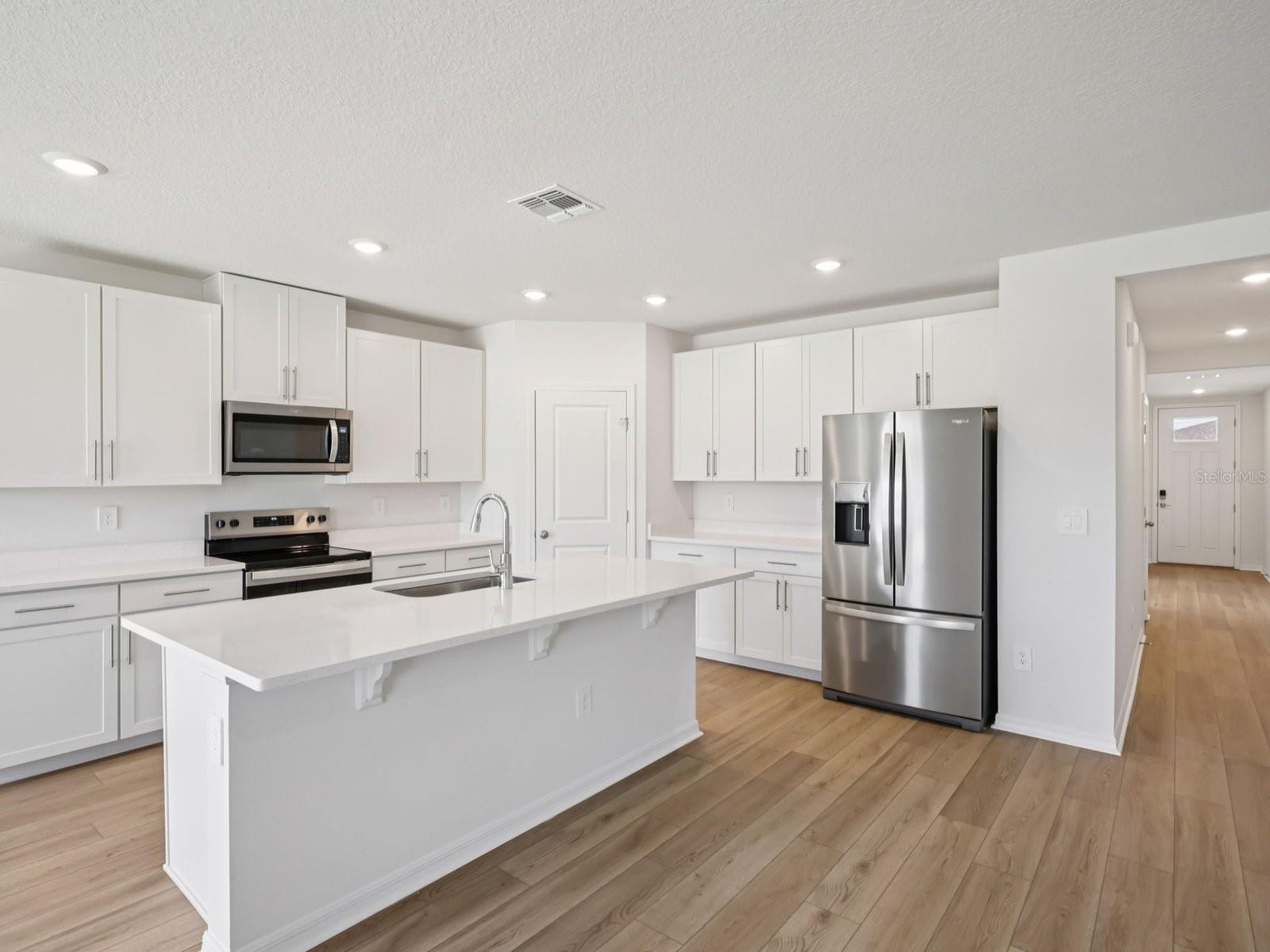 Interior photos are not of the actual home but are photos of the builder home with same floorplan with similar interior finishes and features.