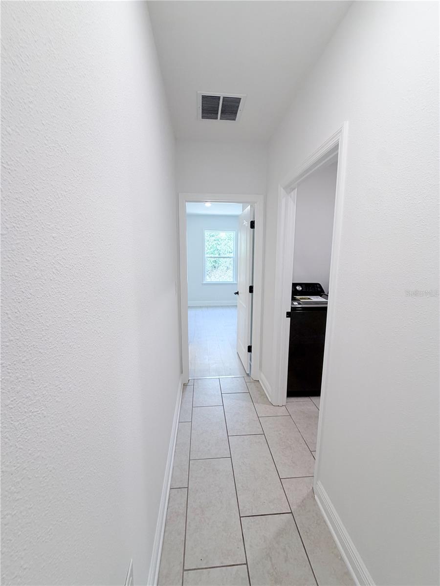 Bedroom 4 door/laundry/hallway
