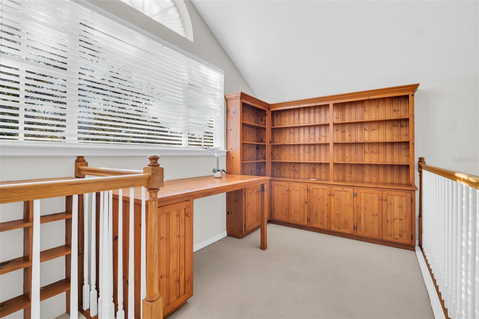 Built-in shelving & desk make this the perfect office space~