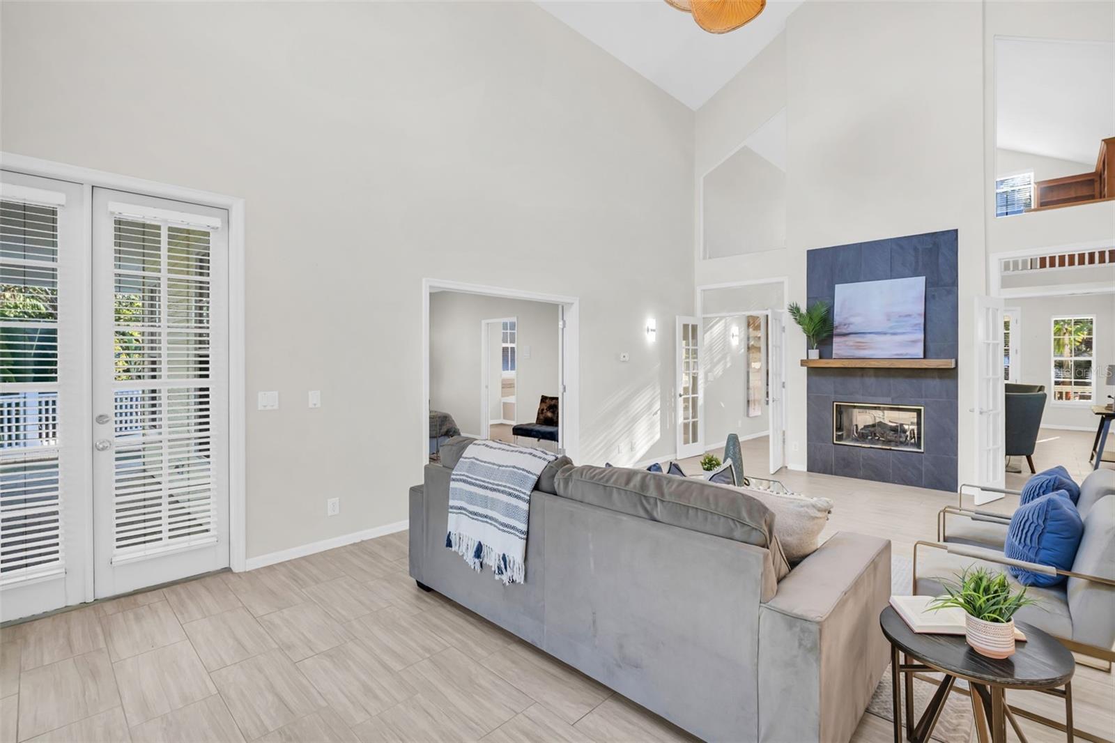 French doors from all main living spaces out to the wrap around porch & pool deck~