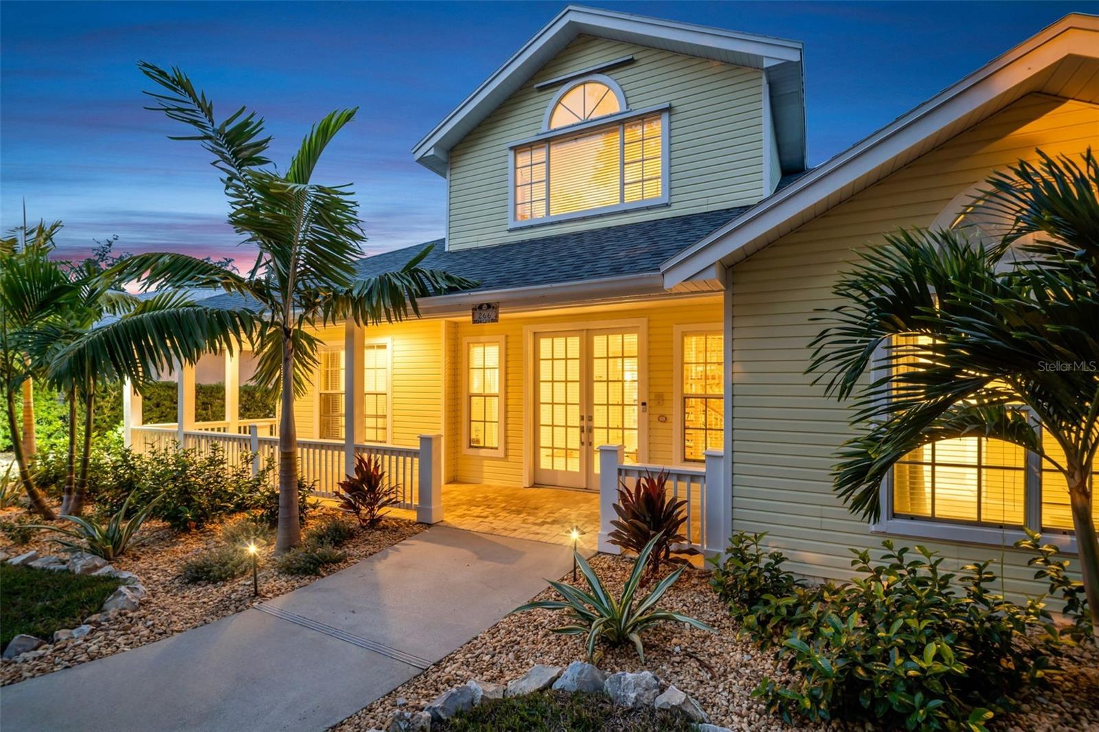 Paver wrap around porch & beautiful double door front entry~