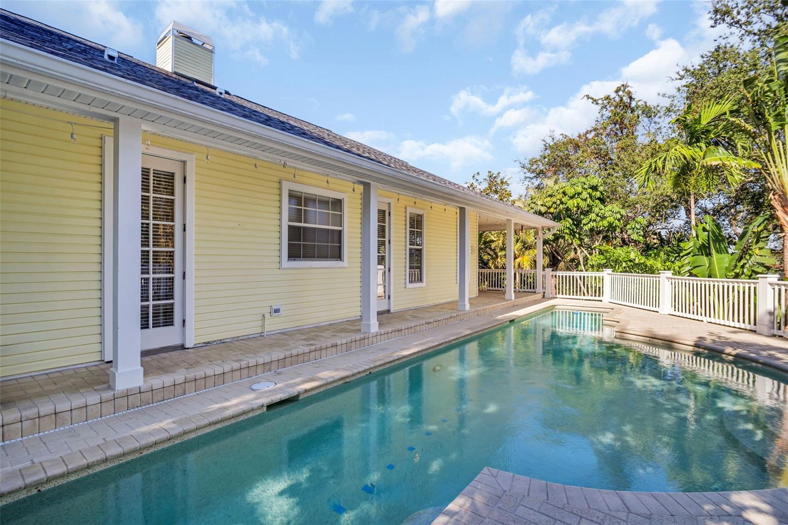 Pristine lap pool perfectly positioned on the side of home~