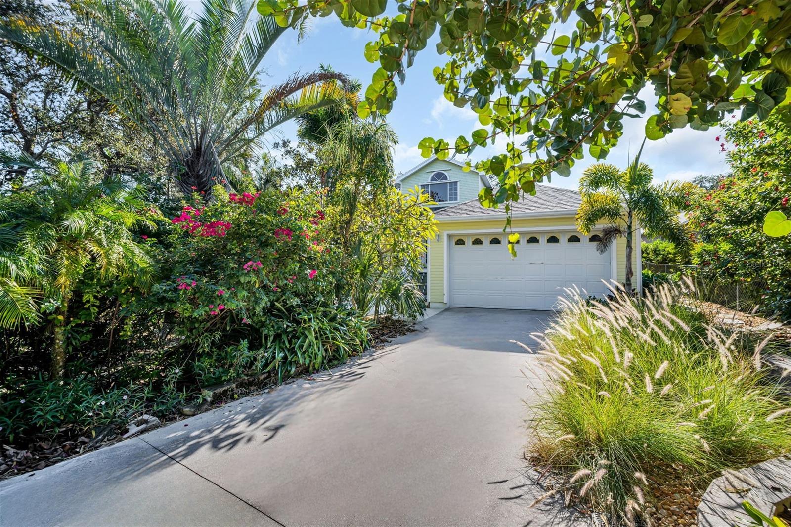 Oversized 2-car garage privately positioned at the rear of home~