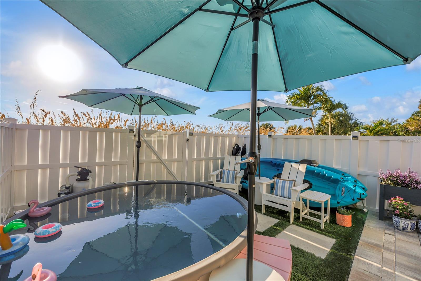 Newer vinyl fencing and soaking saltwater pool.