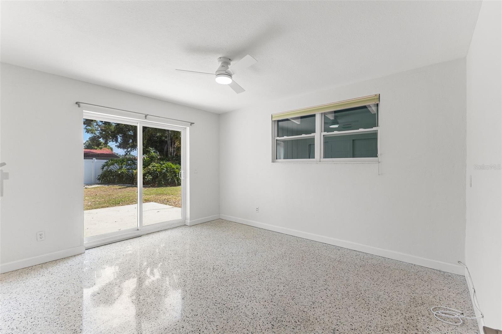 Bedroom 2 - Spacious enough for king size be. Sliding door back yard access