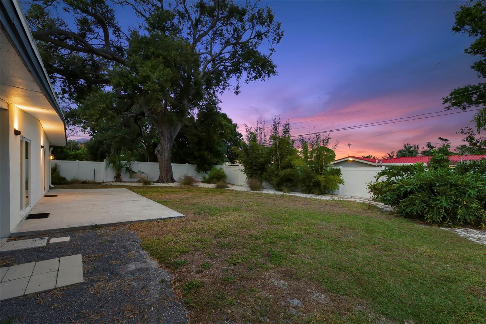 Evening twilight view of backyard
