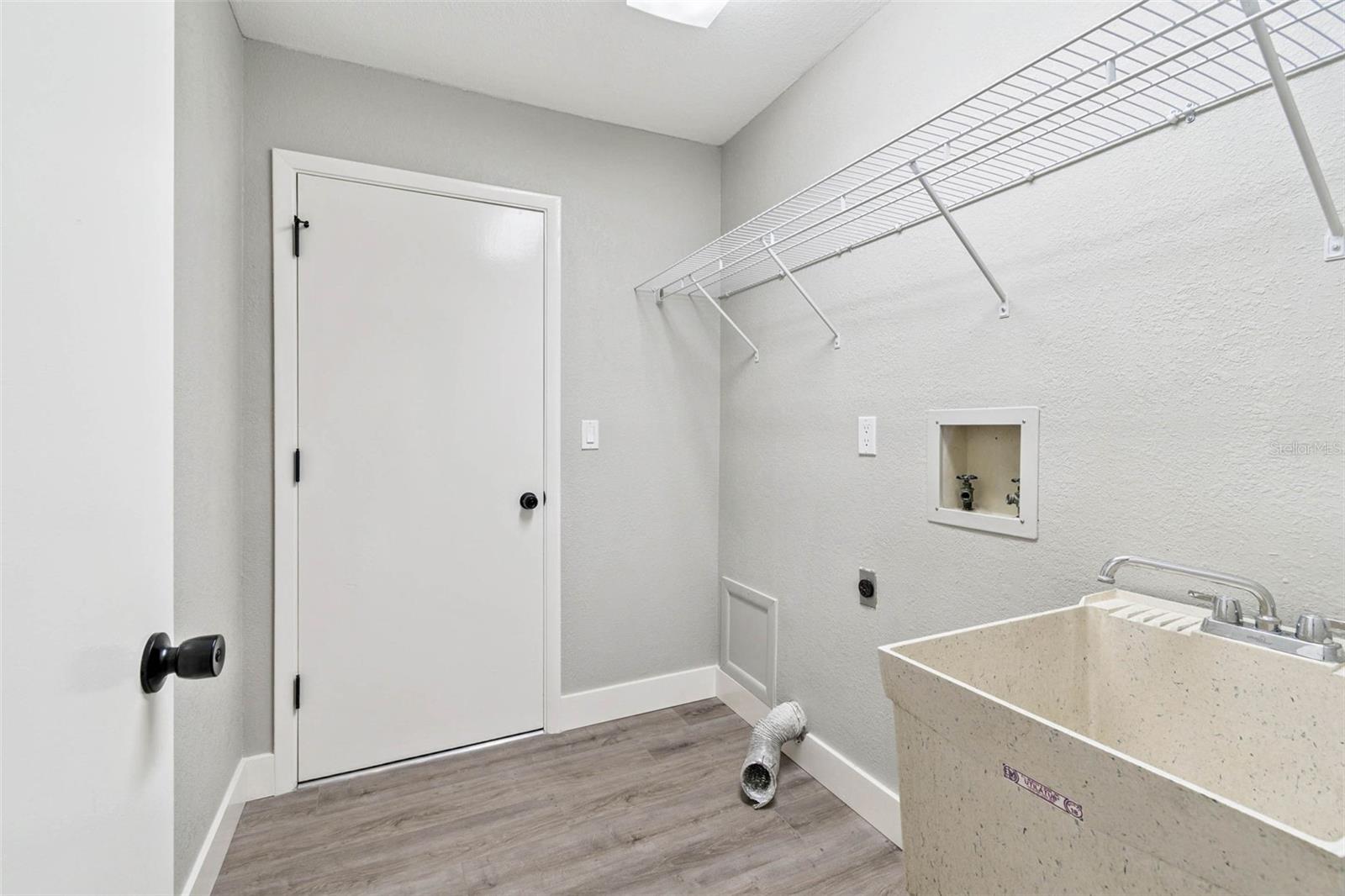 Indoor Laundry room with wash basin