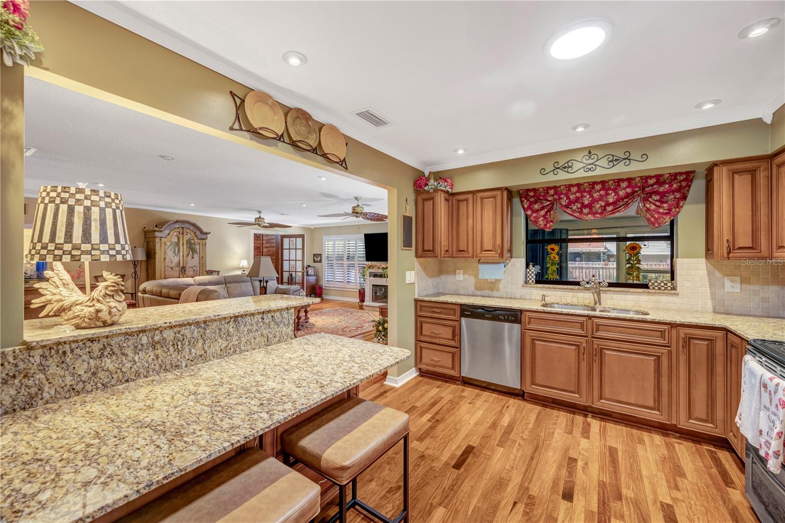 Kitchen with view into Family Room