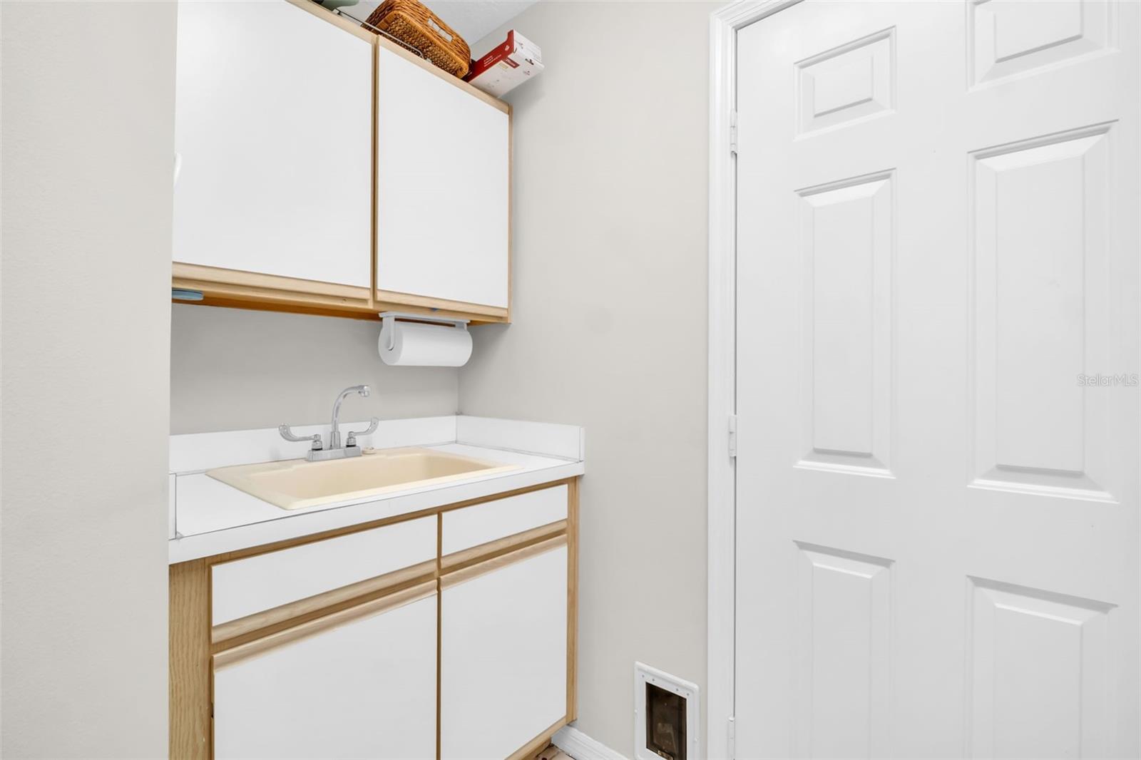 Laundry Room with Utility Sink off Garage