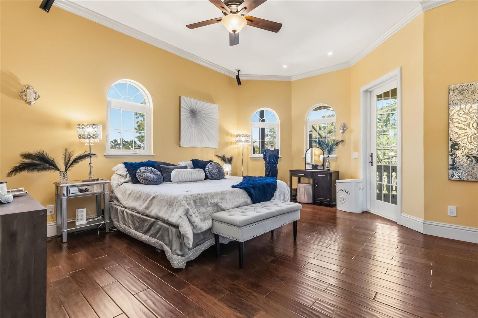 Bedroom with Ensuite Bathroom, Walk-in Closet, and Balcony Access (Back Yard Oasis View)