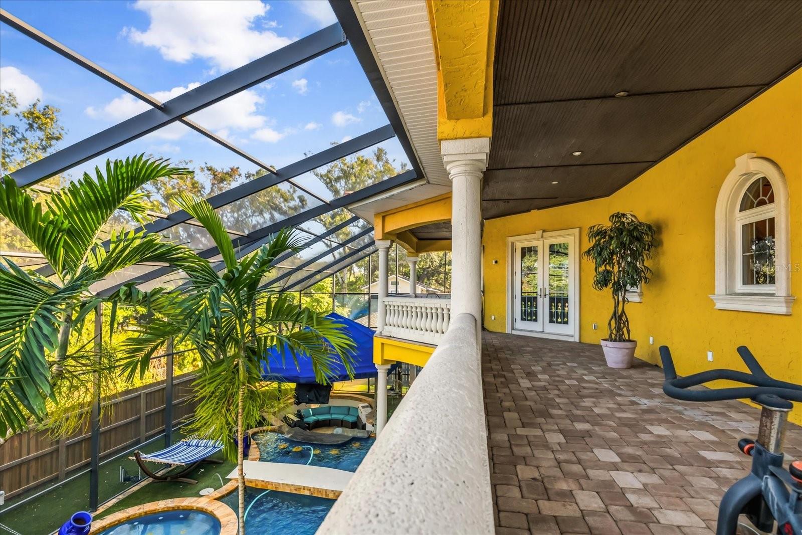 Upper Backyard Oasis Balcony that stretches entire width of home.