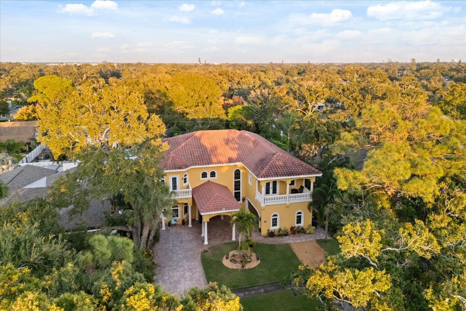 Surrounded by lush mature trees.