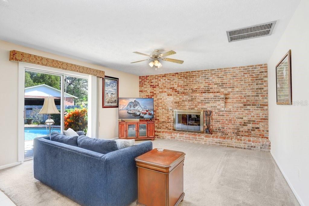 Family room with wood burning fireplace