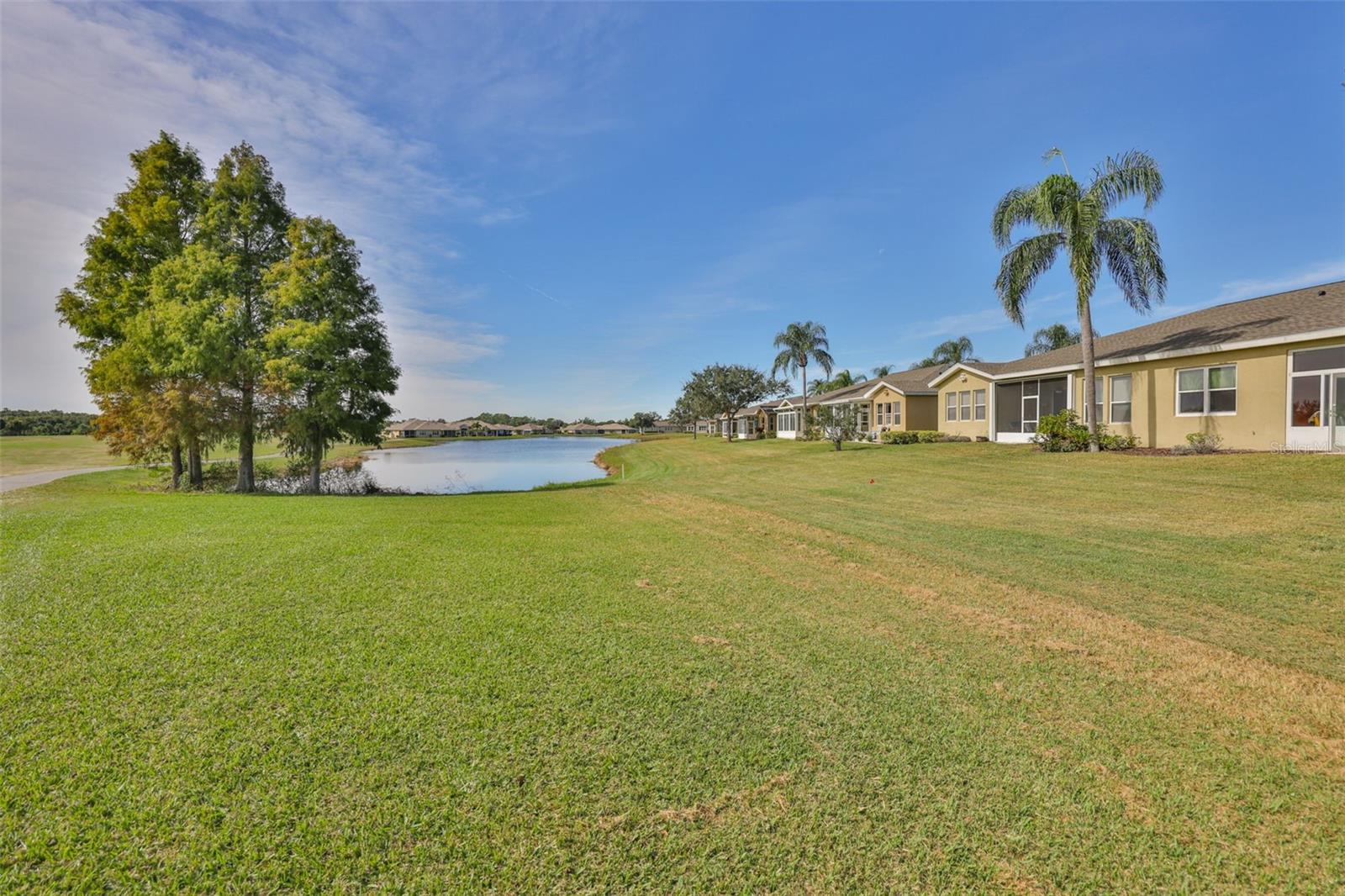 Back yard with pond views and golf cart path