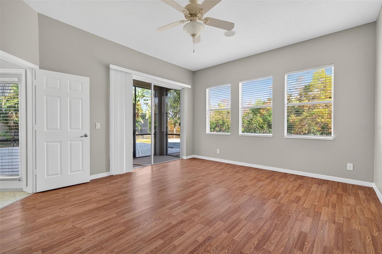 Downstairs Bedroom with private screened lanai and Bathroom