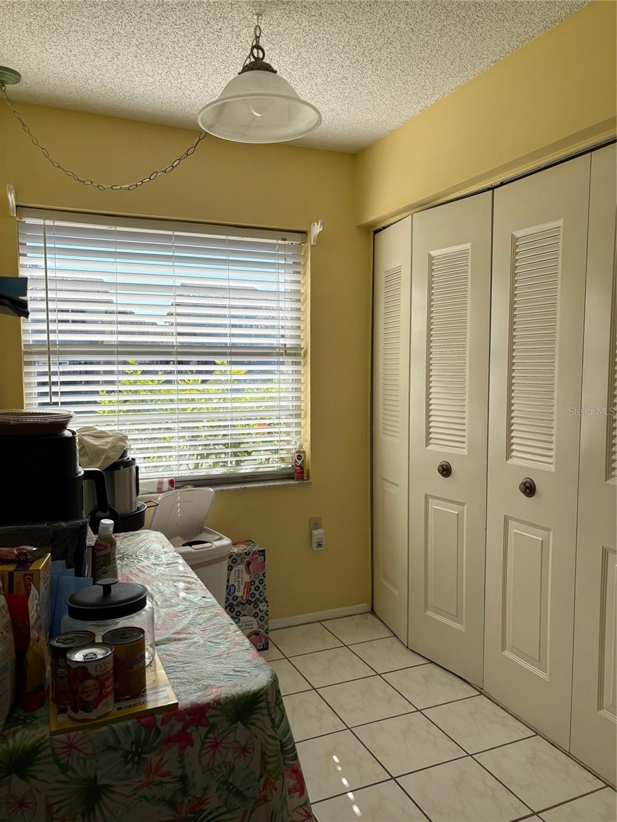 Breakfast area with washer and dryer in closet